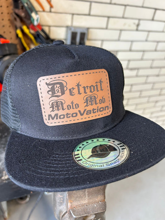 Snap Back Cap - All Black Trucker Hat with Natural Leather Moto Vation Patch